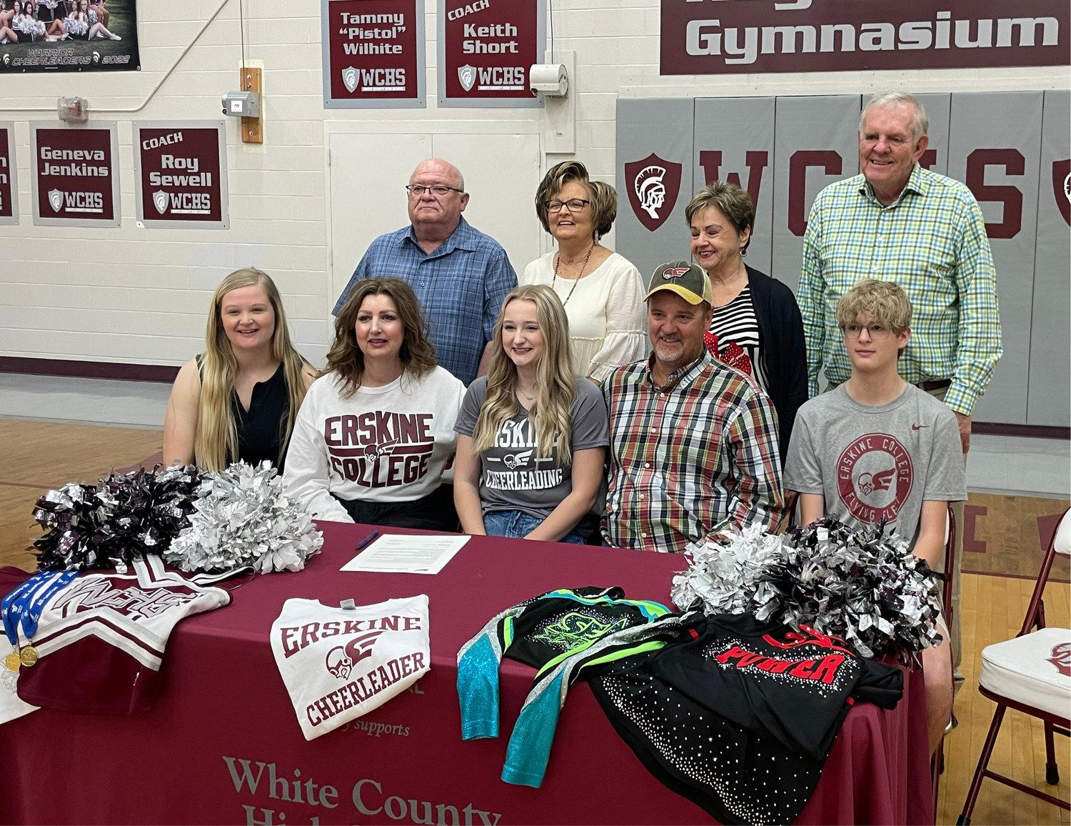 Maddie Wright with parents, siblings, and grandparents